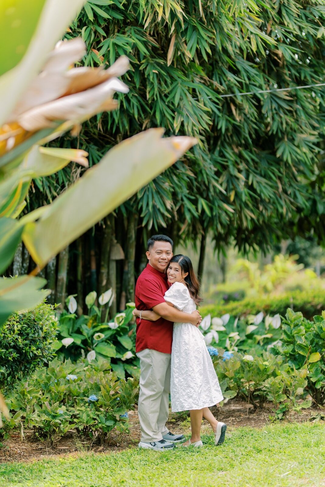 Shelo and Majorie embracing in a lush garden