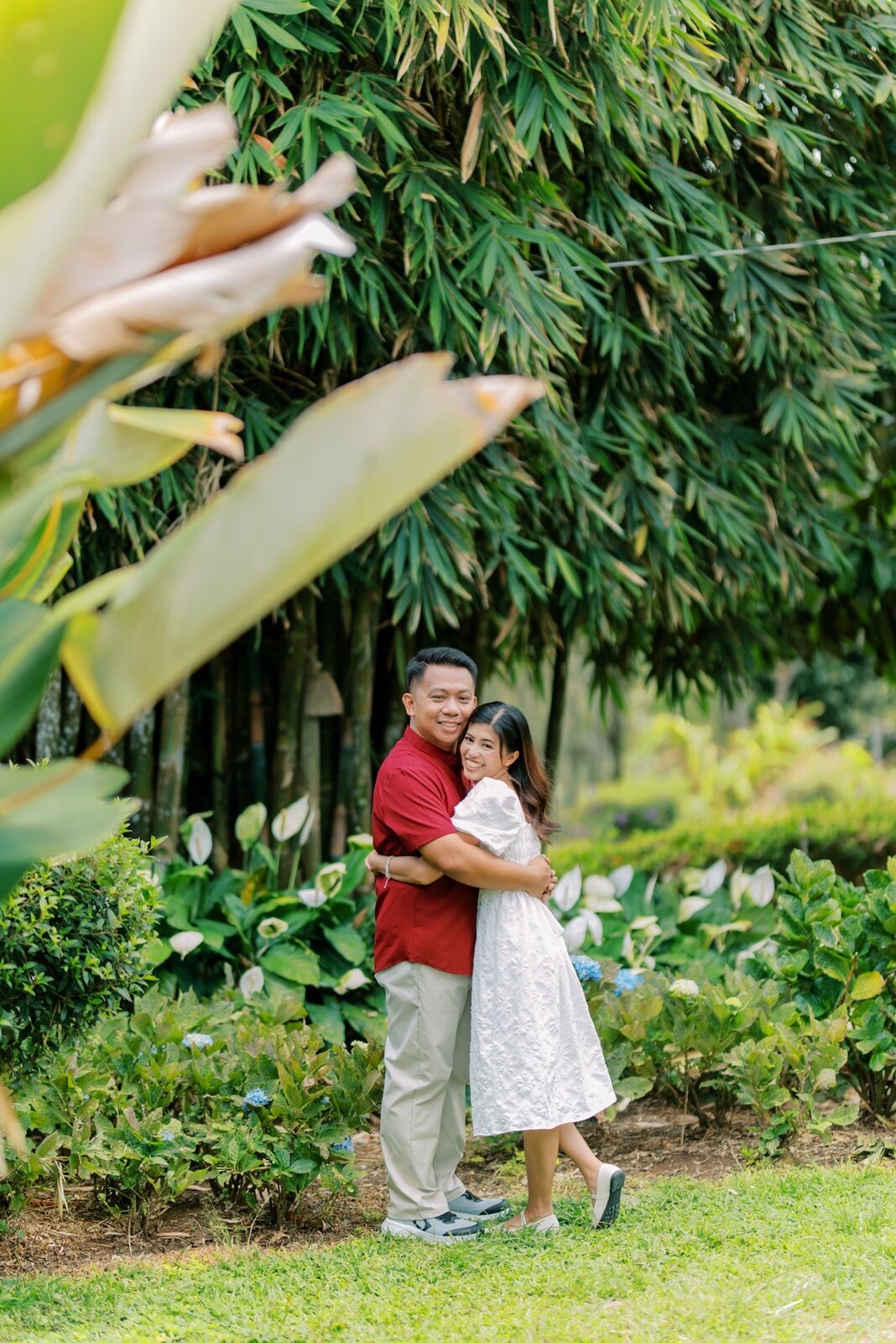 Shelo and Majorie embracing in a lush garden